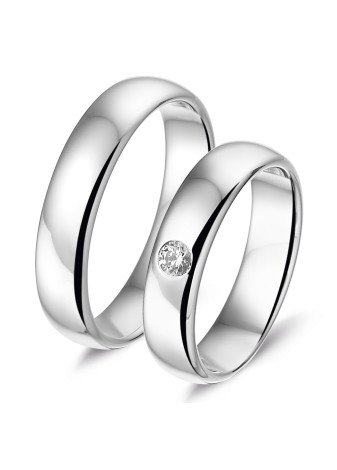 L450 zware witgouden trouwringen met een briljant van 0.12 crt.