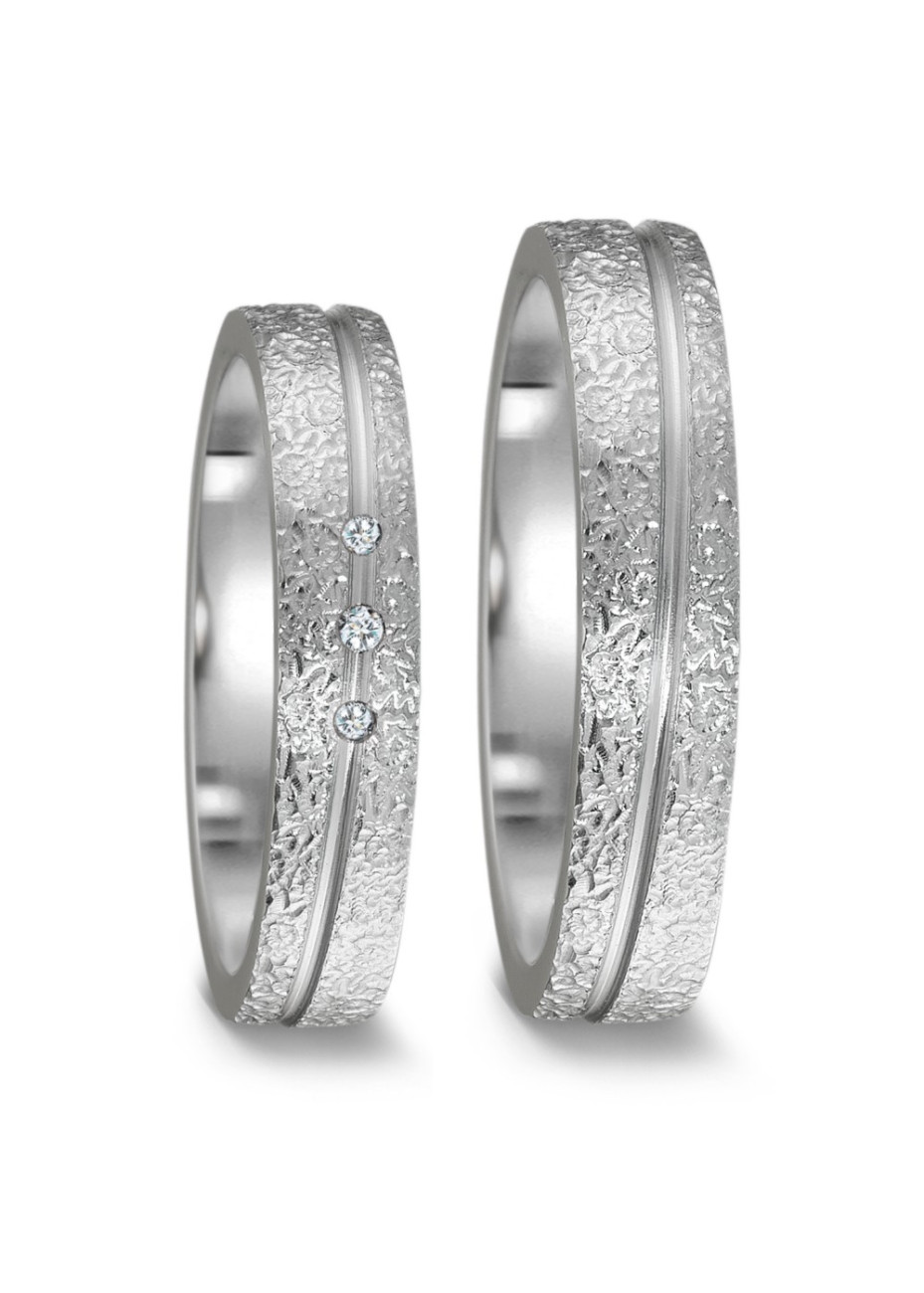 52582-001-003-1000 Teno grillige stalen trouwringen met 0.03 briljant