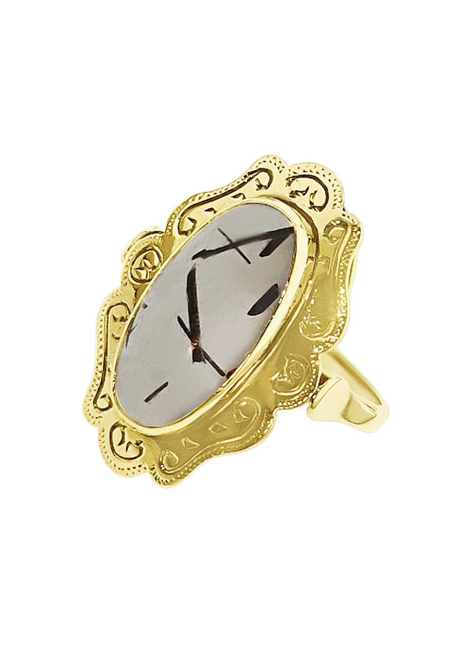 .3.9 gram gouden damesring met doorzichtige steen met zwarte strepen