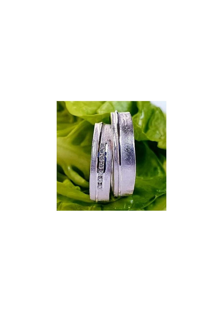 R227-227 Grillige Mathisse trouwringen zilver met 0.07 crt. briljant